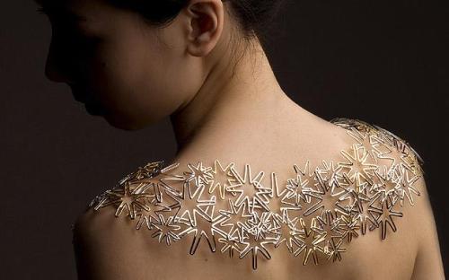 Kity Hefang Sun's intricate shoulder piece is made from gold and crafted upon Origami. Hefang won the Astley Clarke award for outstanding craftsmanship. The Central Saint Martins graduate will see her collection sold on www.astleyClarke.com in 2010.